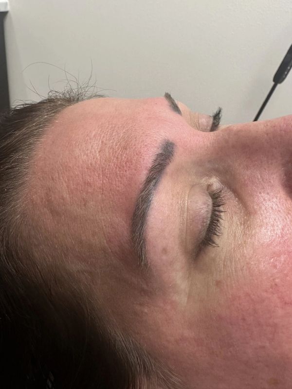 Before — Sparse, uneven brows reshaped with microblading for hair-like definition.