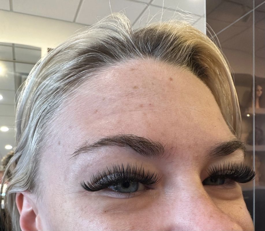 After — Fine, light lashes built up into full, fluttery volume extensions.